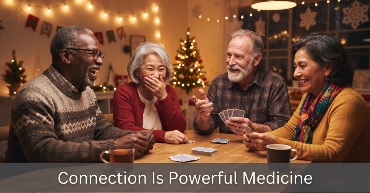 Group of diverse seniors laughing and playing cards together at a community center during winter, showing social connection for mental health